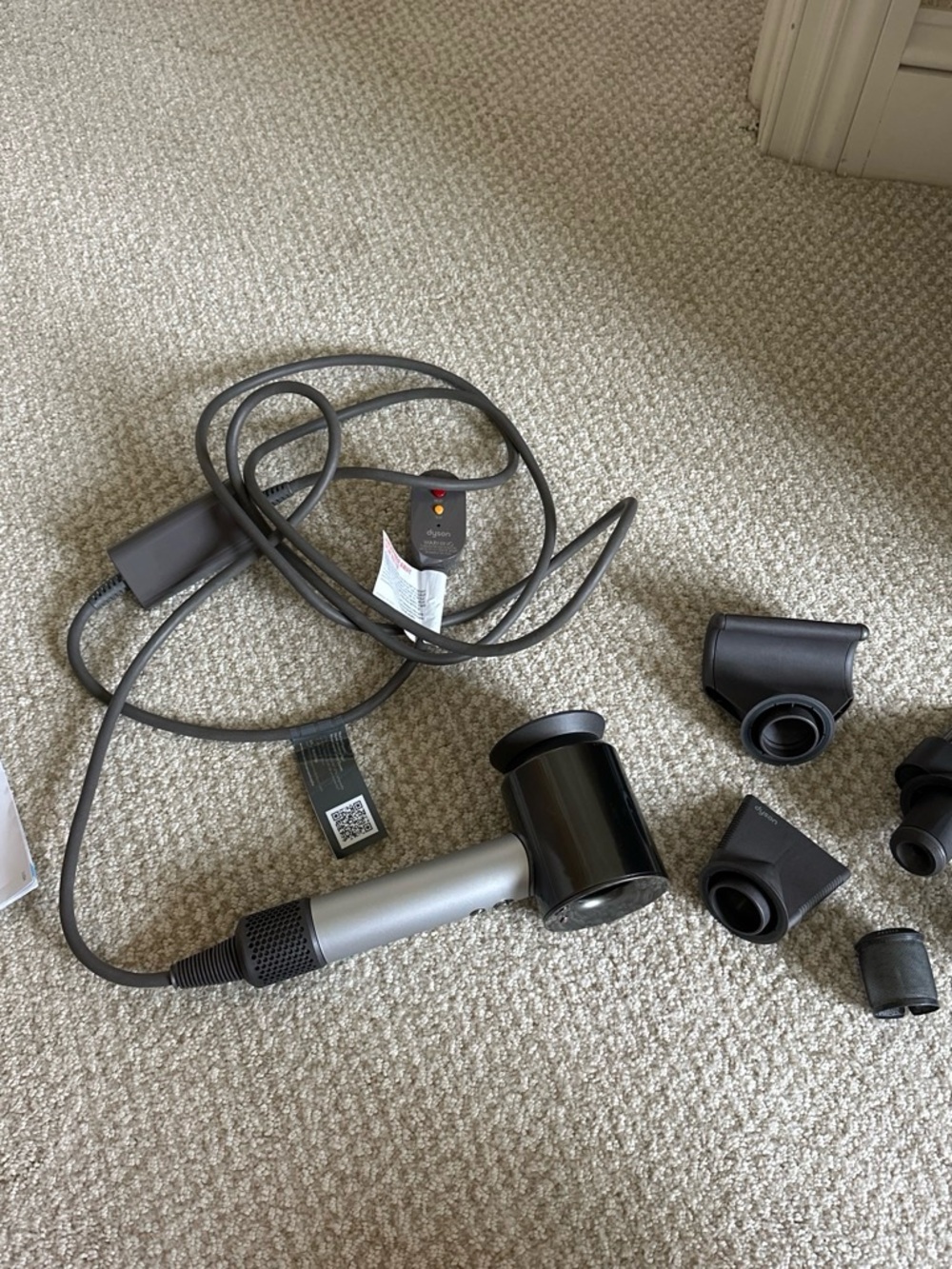 Dyson Black and Silver Hair Dryer with Multiple Attachments